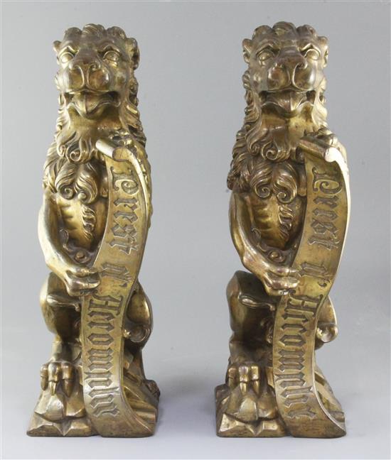 A.W.N. Pugin for Alton Towers. A pair of heavy gilt bronze fire dogs modelled as lions triumphant, c. 1840-50, height 19in.